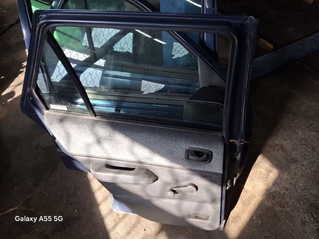 bontott FORD FIESTA III Bal hátsó Ajtó (Részeivel)