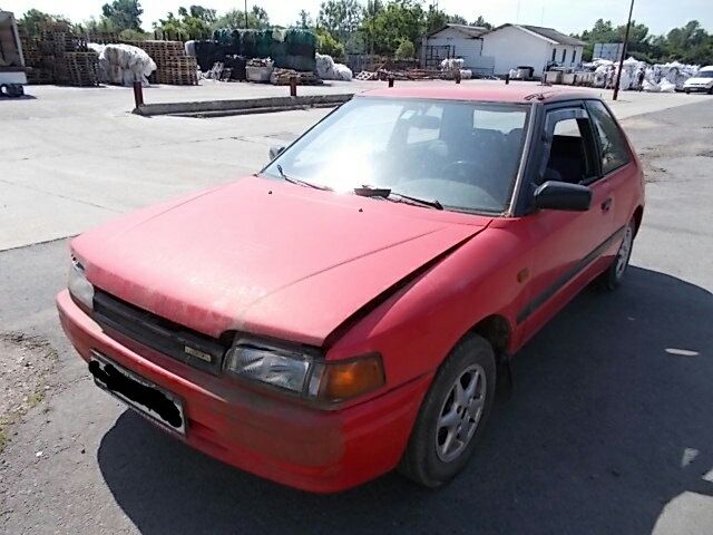 bontott MAZDA 323 Bal első Zsanér