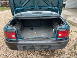 bontott MAZDA 323 Bal hátsó Ajtó (Üres lemez)