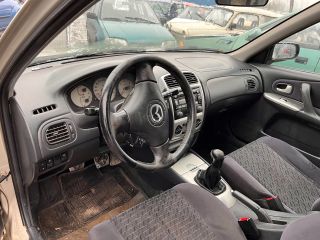 bontott MAZDA 323 Bal Napellenző