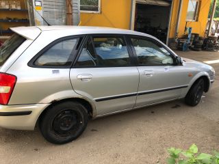 bontott MAZDA 323 Csomagtérajtó Díszléc