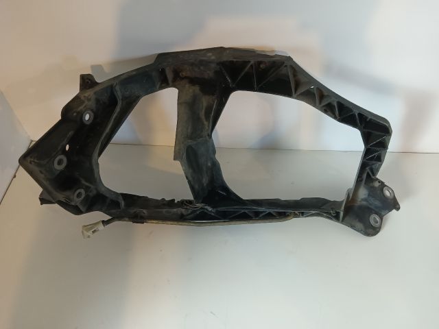 bontott MITSUBISHI COLT Bal Fényszóró Tartó