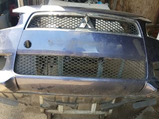 bontott MITSUBISHI LANCER Első Lökhárító (Üresen)