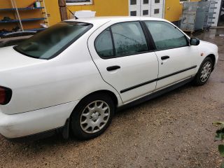 bontott NISSAN PRIMERA Jobb első Féknyereg Munkahengerrel