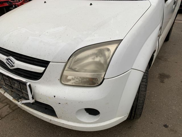 bontott SUZUKI IGNIS II Jobb hátsó Rugó