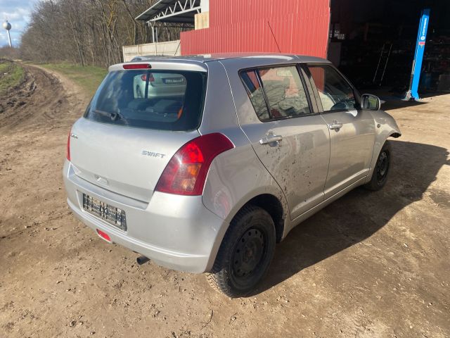 bontott SUZUKI SWIFT III Bal hátsó Lökhárító Tartó (Műanyag)